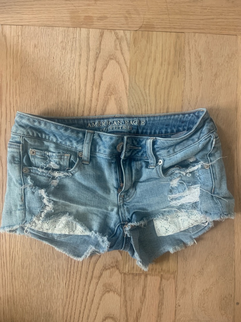 American Eagle Outfitters Light Wash Distressed Denim Shorts with Lace
